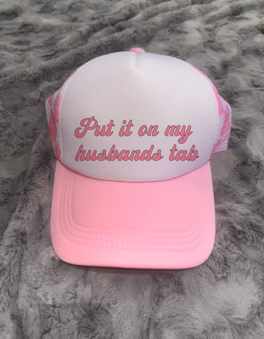 Put It On My Husbands Tab Trucker Hat